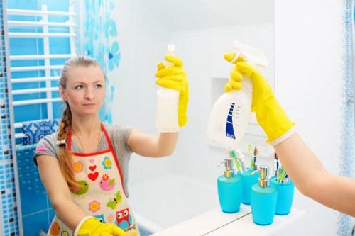 Professional carpets cleaner in Kennington treating a living room carpet