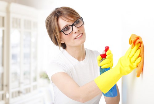 Cleaner wearing PPE during a deep cleaning task