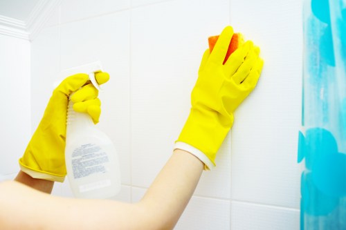 Technician cleaning kitchen surfaces during a deep cleaning appointment